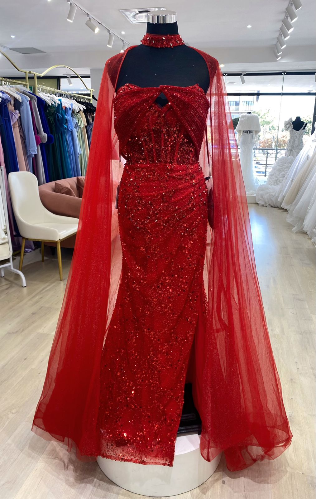 Red beaded evening dress with cape.
